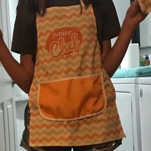 I’m selling a kids Junior Chef apron. colors are Orange, White, and a tan color.